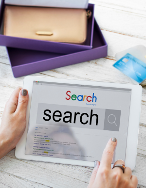 Digital marketer analyzing search engine results on a tablet, showcasing skills in ranking, crawling, and technical SEO