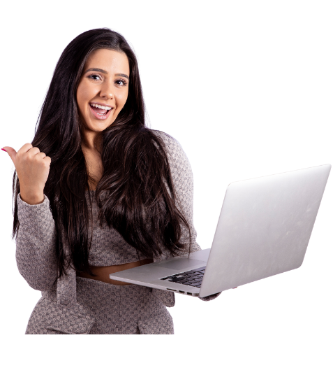 Smiling woman holding a laptop and raising her fist in excitement, representing confidence and learning success.