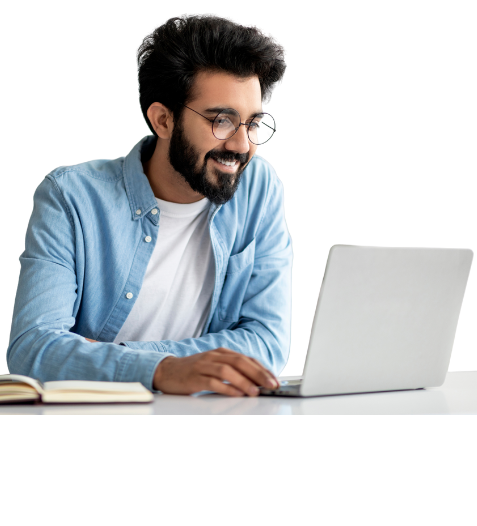 Smiling man with glasses working on a laptop, representing online learning and skill development.