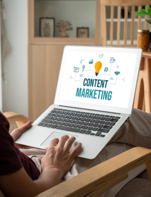 Person learning content marketing strategies on a laptop, focusing on blog writing, SEO, and campaign planning