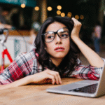 Student appearing stressed and overwhelmed, representing challenges faced without hands-on digital marketing skills.