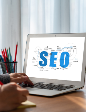 Person learning SEO strategies on a laptop, focusing on keyword research, on-page optimization, and analytics tools